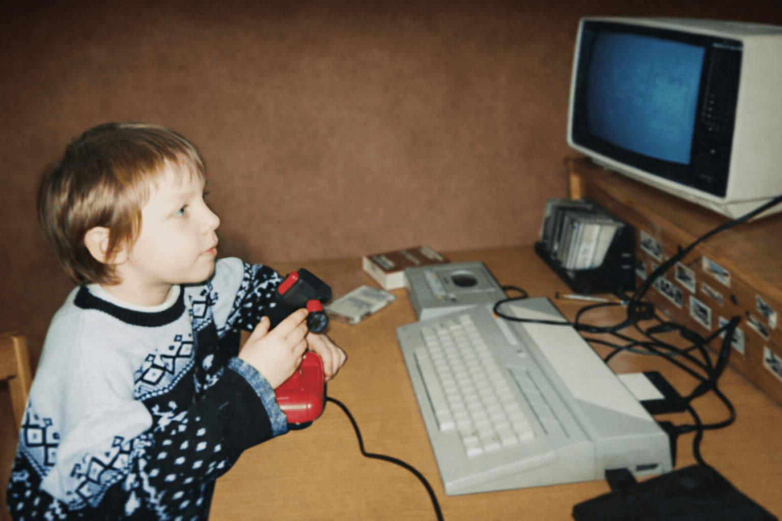 Young Tomasz with Atari 65XE computer